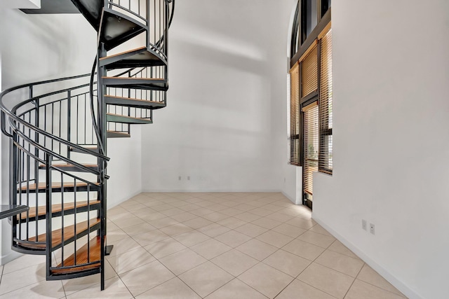 801 S Olive Ave Unit 127, West Palm Beach, FL 33401 - stairs featuring tile patterned flooring