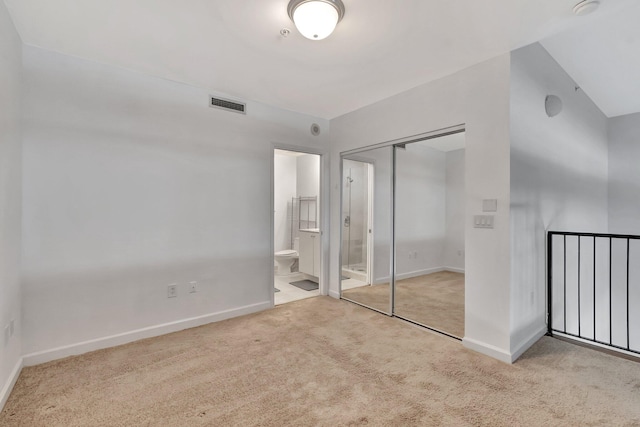 801 S Olive Ave Unit 127, West Palm Beach, FL 33401 - unfurnished bedroom featuring visible vents, baseboards, carpet flooring, and a closet