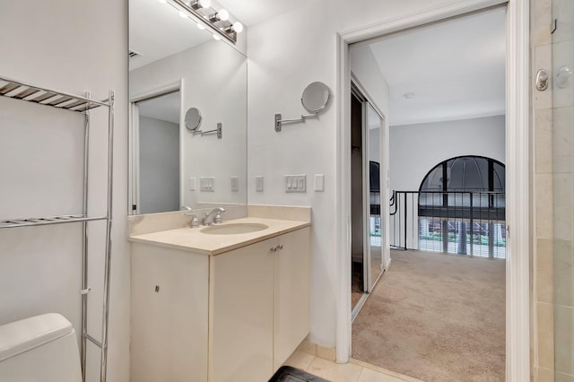 801 S Olive Ave Unit 127, West Palm Beach, FL 33401 - bathroom featuring tile patterned floors, toilet, and vanity