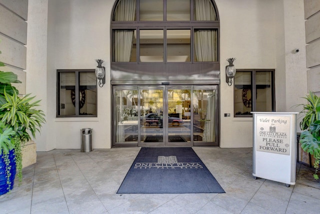 801 S Olive Ave Unit 127, West Palm Beach, FL 33401 - doorway to property with stucco siding