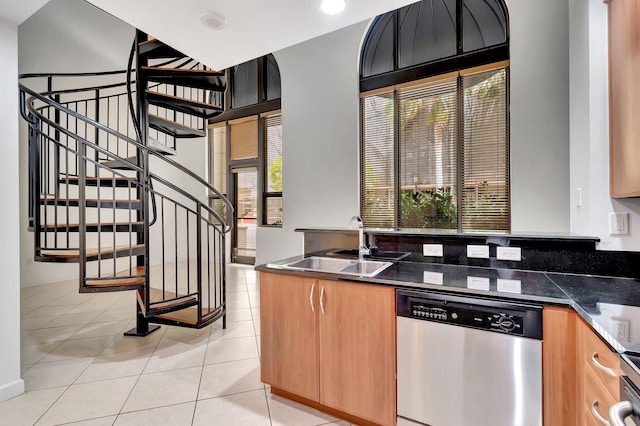801 S Olive Ave Unit 127, West Palm Beach, FL 33401 - kitchen with light tile patterned floors, a sink, and dishwasher