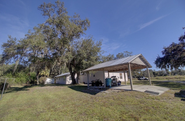 view of yard featuring an attached carport