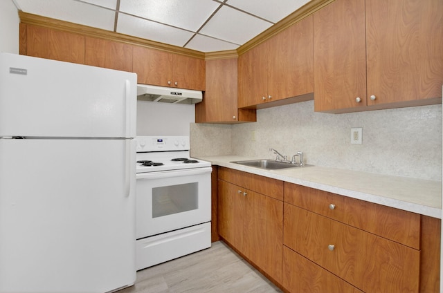 63 Dorset Unit B, Boca Raton, FL 33434 - kitchen featuring white appliances, under cabinet range hood, light countertops, and tasteful backsplash