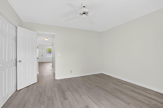 63 Dorset Unit B, Boca Raton, FL 33434 - unfurnished bedroom featuring light wood-style flooring, a closet, and a ceiling fan