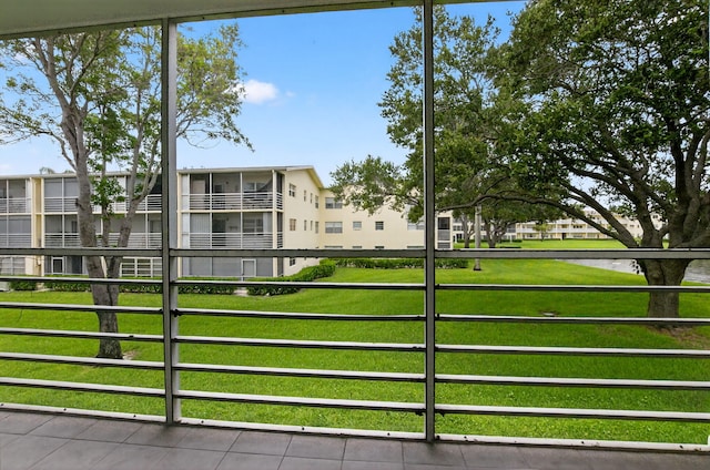63 Dorset Unit B, Boca Raton, FL 33434 - view of home's community featuring a gate and a yard