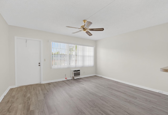 63 Dorset Unit B, Boca Raton, FL 33434 - spare room with wood finished floors, ceiling fan, heating unit, and a textured ceiling