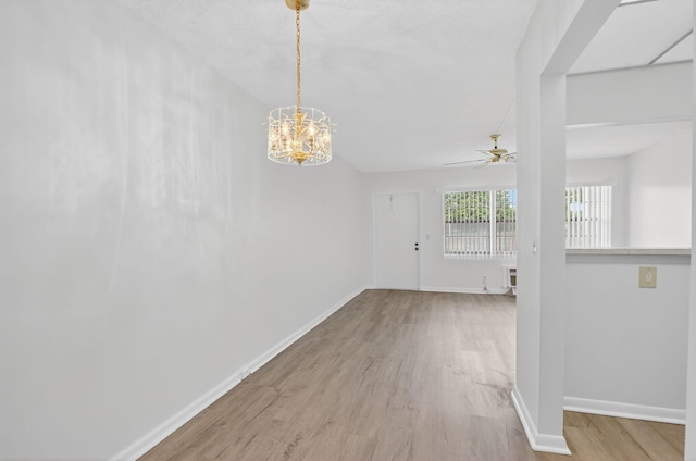 63 Dorset Unit B, Boca Raton, FL 33434 - spare room featuring wood finished floors, ceiling fan, and a chandelier