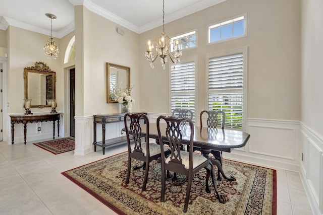 dining area featuring plenty of natural light, crown molding, light tile patterned floors, and an inviting chandelier