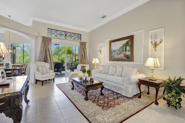 living area with baseboards, visible vents, ornamental molding, and light tile patterned floors