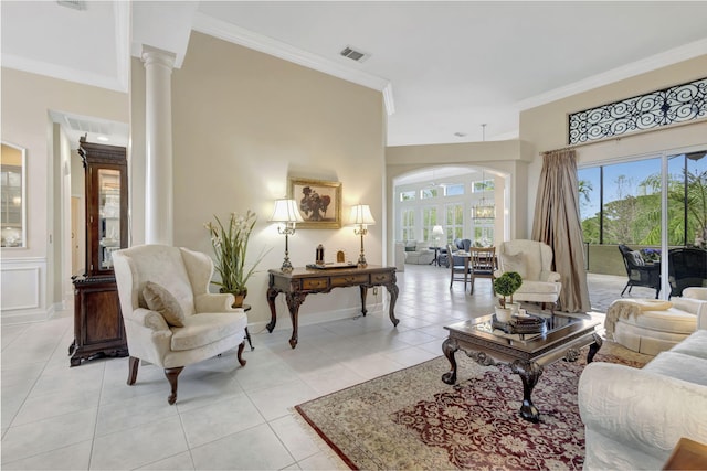 living room with visible vents, arched walkways, ornamental molding, and light tile patterned floors