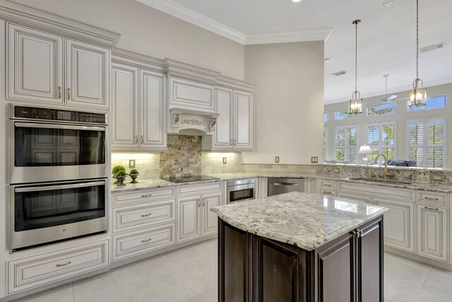 kitchen with crown molding, backsplash, a sink, stainless steel appliances, and custom range hood
