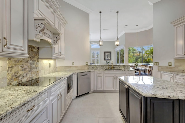 kitchen with a sink, ornamental molding, light tile patterned floors, and stainless steel appliances