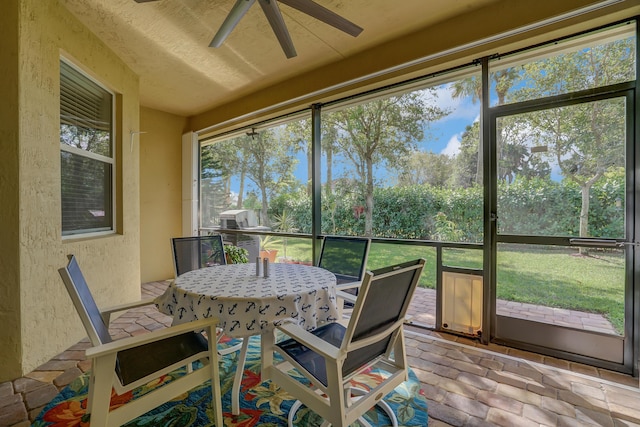 9328 Silent Oak Cir, West Palm Beach, FL 33411 - sunroom featuring ceiling fan and outdoor dining area