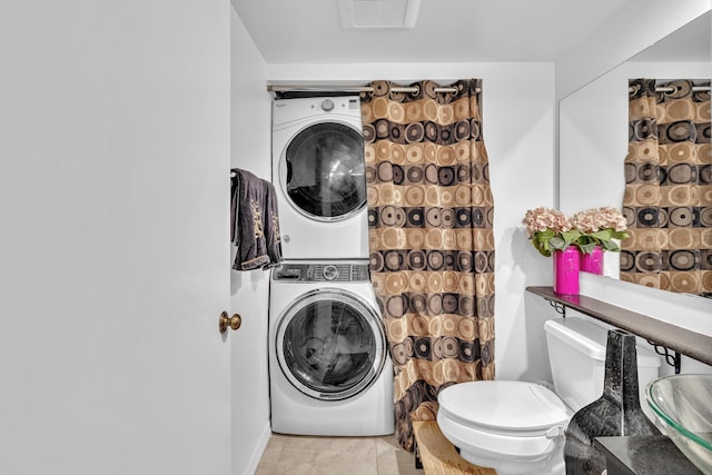 211 2nd Ct, Palm Beach Gardens, FL 33410 - bathroom featuring estacked washer and dryer, toilet, and vanity