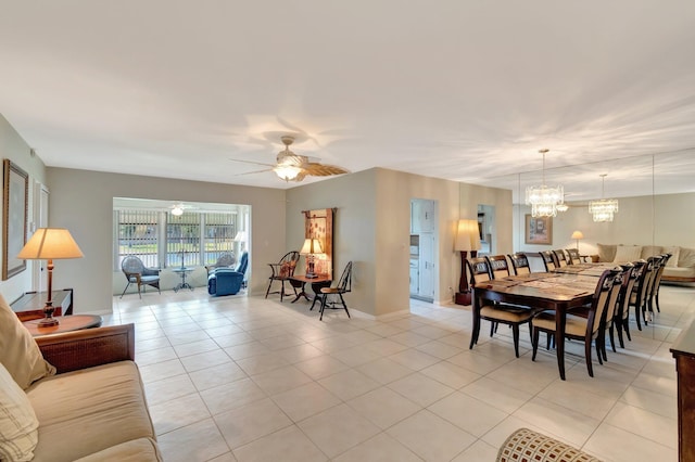 1245 High Point Pl S Unit C, Delray Beach, FL 33445 - dining area featuring light tile patterned flooring, baseboards, and ceiling fan with notable chandelier