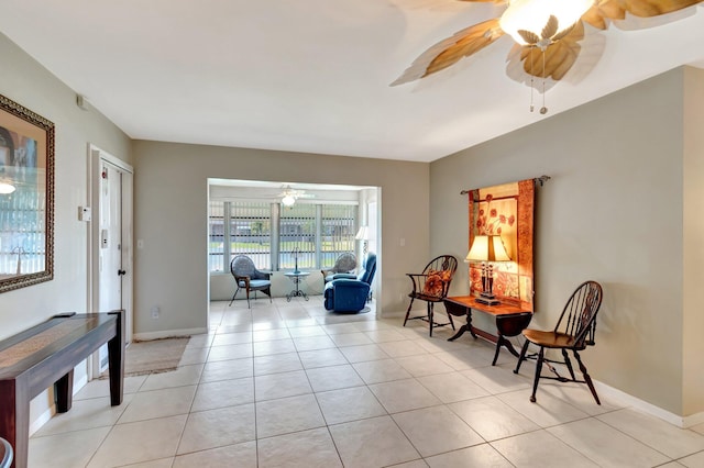 1245 High Point Pl S Unit C, Delray Beach, FL 33445 - sitting room with light tile patterned floors, baseboards, and ceiling fan