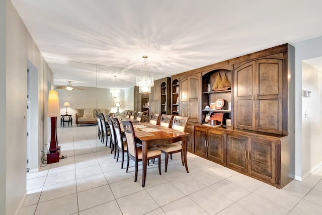 1245 High Point Pl S Unit C, Delray Beach, FL 33445 - dining area featuring baseboards, ceiling fan with notable chandelier, and light tile patterned floors