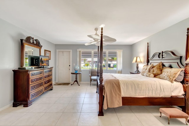 1245 High Point Pl S Unit C, Delray Beach, FL 33445 - bedroom with baseboards, a ceiling fan, and light tile patterned flooring
