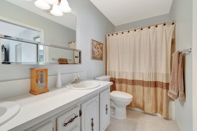 1245 High Point Pl S Unit C, Delray Beach, FL 33445 - full bathroom featuring a notable chandelier, vanity, toilet, tile patterned floors, and a shower with curtain