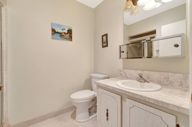 1245 High Point Pl S Unit C, Delray Beach, FL 33445 - bathroom with vanity, tile patterned flooring, a shower stall, and toilet