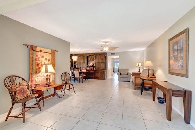 1245 High Point Pl S Unit C, Delray Beach, FL 33445 - living area featuring baseboards, ceiling fan, and light tile patterned floors