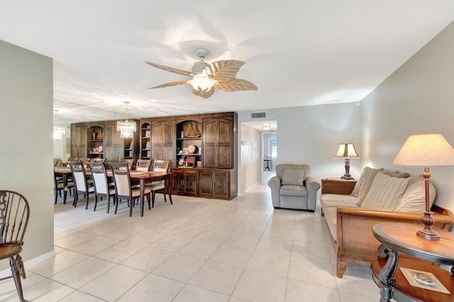 1245 High Point Pl S Unit C, Delray Beach, FL 33445 - dining space with light tile patterned flooring, baseboards, visible vents, and ceiling fan with notable chandelier