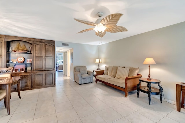 1245 High Point Pl S Unit C, Delray Beach, FL 33445 - living room featuring visible vents, baseboards, ceiling fan, and light tile patterned floors