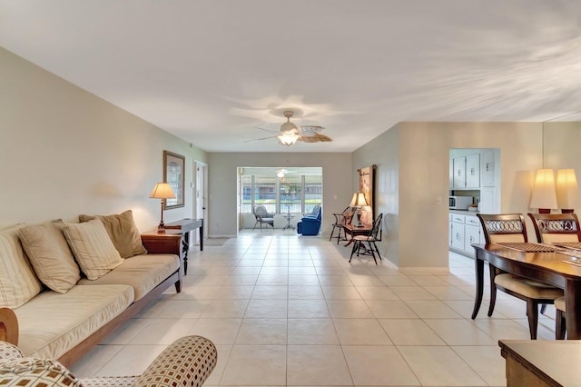 1245 High Point Pl S Unit C, Delray Beach, FL 33445 - living room featuring baseboards, ceiling fan, and light tile patterned floors