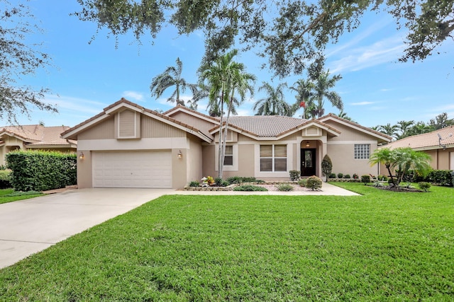 single story home featuring a tiled roof, a garage, concrete driveway, a front lawn, and stucco siding
