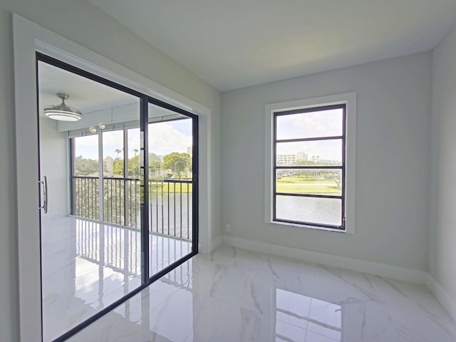 empty room with marble finish floor and baseboards