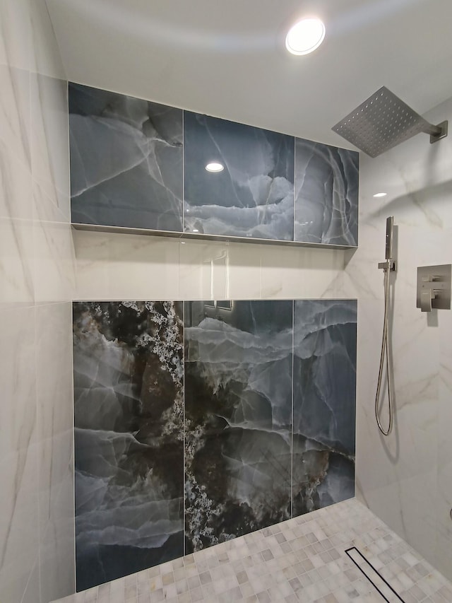 bathroom with recessed lighting and a marble finish shower
