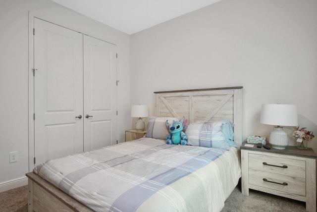 bedroom with a closet and carpet floors