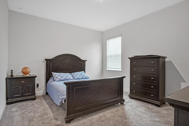 carpeted bedroom with baseboards