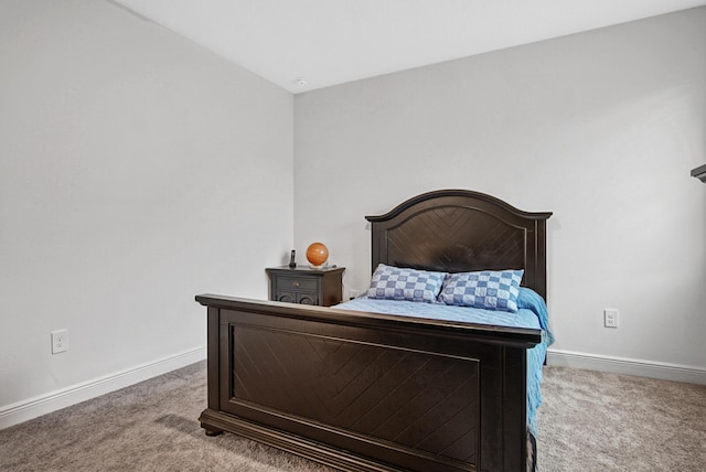 carpeted bedroom featuring baseboards