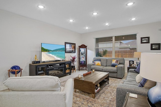 living area with baseboards and recessed lighting