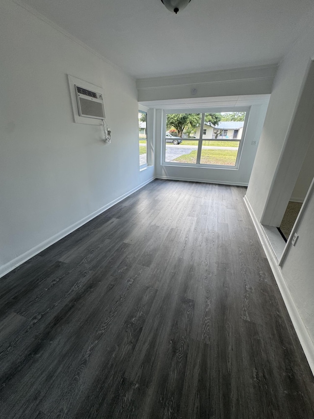 7507 Arthurs Rd, Fort Pierce, FL 34951 - interior space featuring dark wood-style floors, an AC wall unit, and baseboards