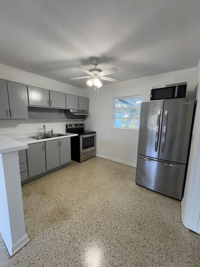 7507 Arthurs Rd, Fort Pierce, FL 34951 - kitchen with a sink, light countertops, ceiling fan, appliances with stainless steel finishes, and gray cabinetry
