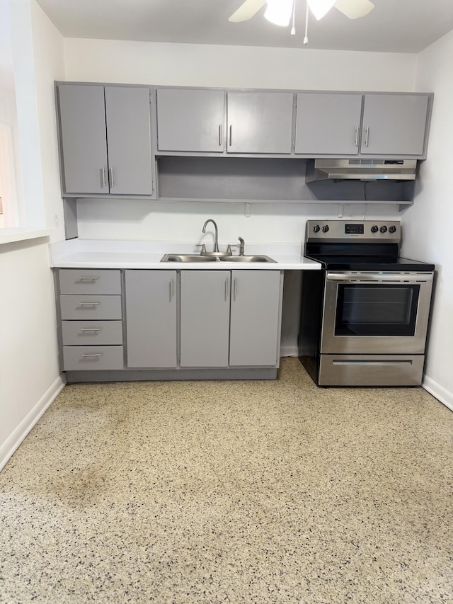 7507 Arthurs Rd, Fort Pierce, FL 34951 - kitchen with stainless steel electric range, a sink, gray cabinetry, and under cabinet range hood
