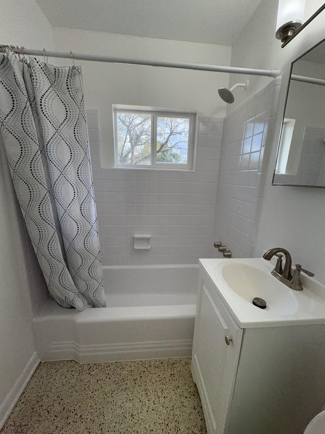 7507 Arthurs Rd, Fort Pierce, FL 34951 - full bathroom with speckled floor, baseboards, shower / bathtub combination with curtain, and vanity