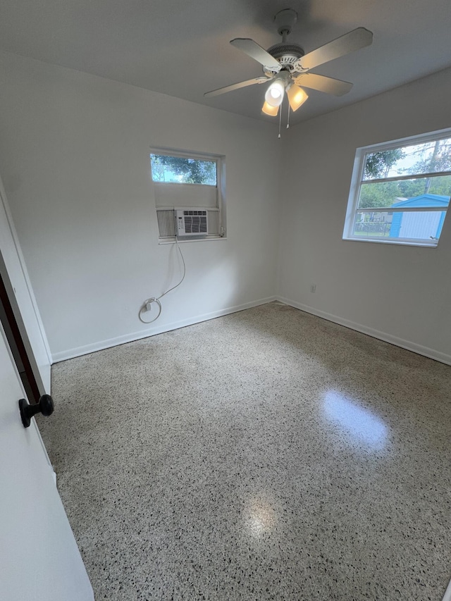 7507 Arthurs Rd, Fort Pierce, FL 34951 - unfurnished room featuring cooling unit, baseboards, speckled floor, and ceiling fan