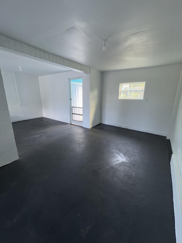 7507 Arthurs Rd, Fort Pierce, FL 34951 - empty room with baseboards and finished concrete floors