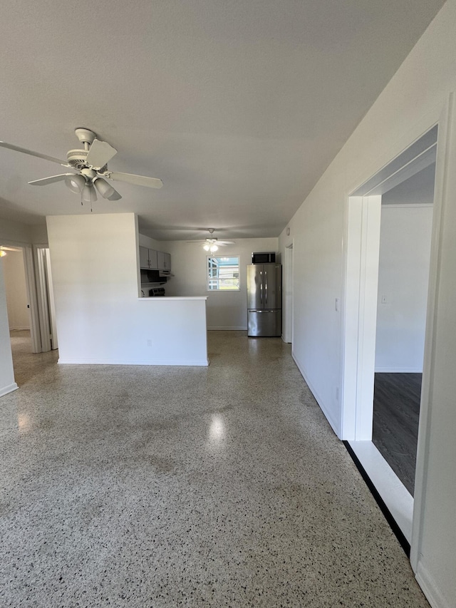 7507 Arthurs Rd, Fort Pierce, FL 34951 - spare room featuring speckled floor and a ceiling fan