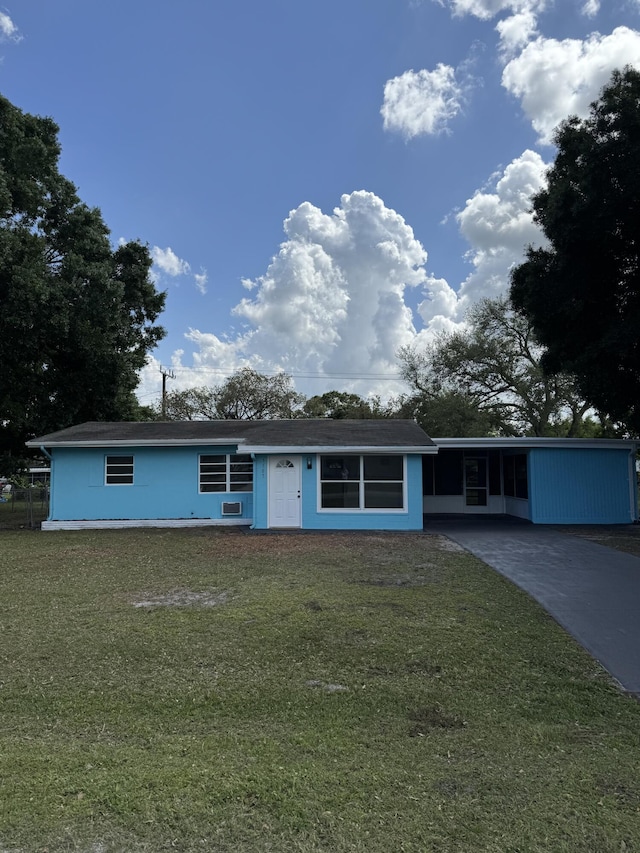 7507 Arthurs Rd, Fort Pierce, FL 34951 - ranch-style home featuring driveway and a front lawn