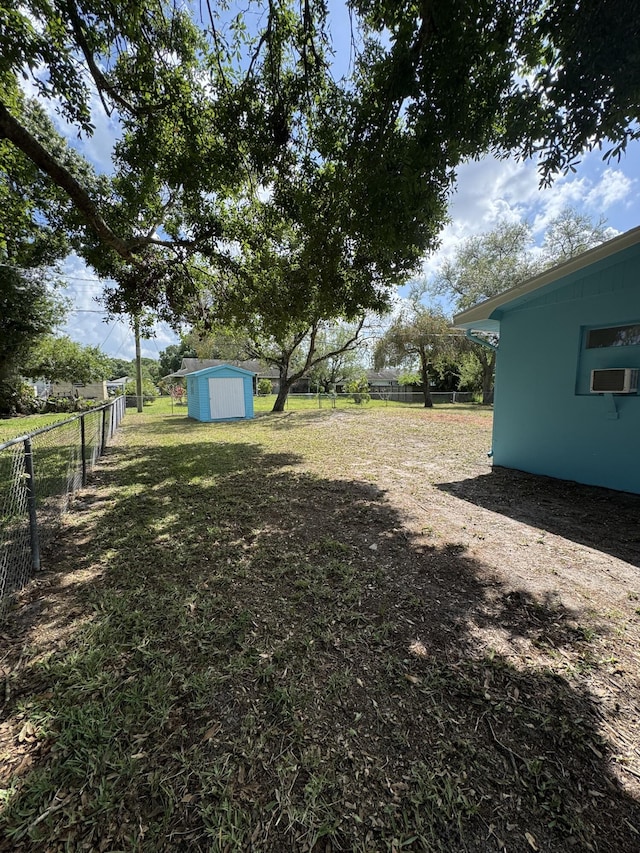 7507 Arthurs Rd, Fort Pierce, FL 34951 - view of yard with an outbuilding, fence, cooling unit, and a shed