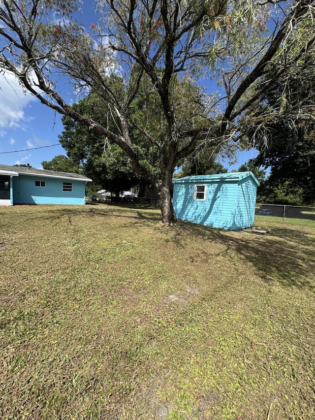 7507 Arthurs Rd, Fort Pierce, FL 34951 - view of yard with an outbuilding, fence, and a shed