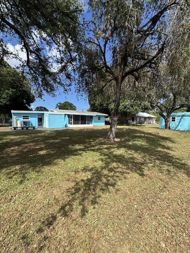 7507 Arthurs Rd, Fort Pierce, FL 34951 - view of yard with a sunroom