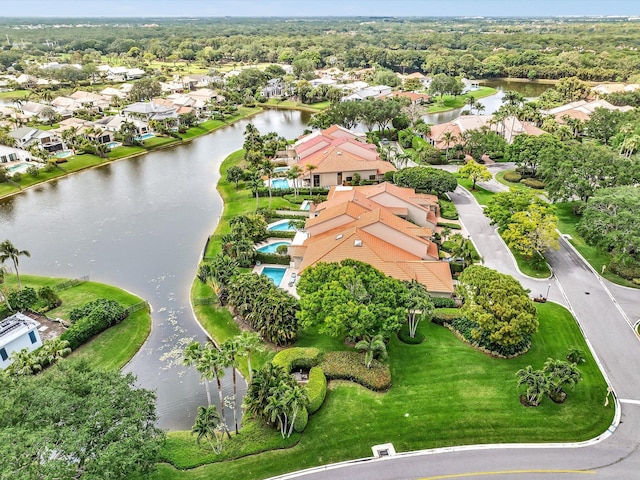 aerial perspective of suburban area with a nearby body of water