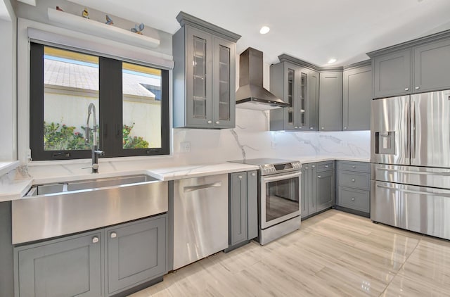 2430 NW 14th St, Delray Beach, FL 33445 - kitchen with stainless steel appliances, wall chimney exhaust hood, gray cabinetry, tasteful backsplash, and recessed lighting