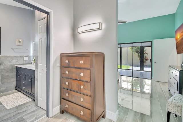 2430 NW 14th St, Delray Beach, FL 33445 - full bathroom featuring vanity, wood finished floors, and a high ceiling