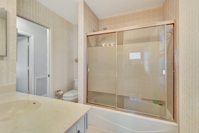 2430 NW 14th St, Delray Beach, FL 33445 - bathroom with vanity, bath / shower combo with glass door, and wallpapered walls
